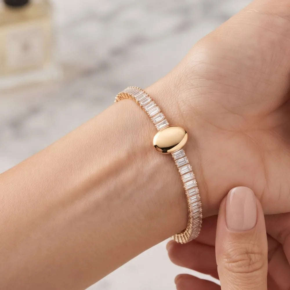 Close-up shot of a woman wearing the Golden Naqsh viral trending Oval Diamond Bracelet on her wrist, showcasing its luxurious everyday elegance