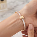 Close-up shot of a woman wearing the Golden Naqsh viral trending Oval Diamond Bracelet on her wrist, showcasing its luxurious everyday elegance