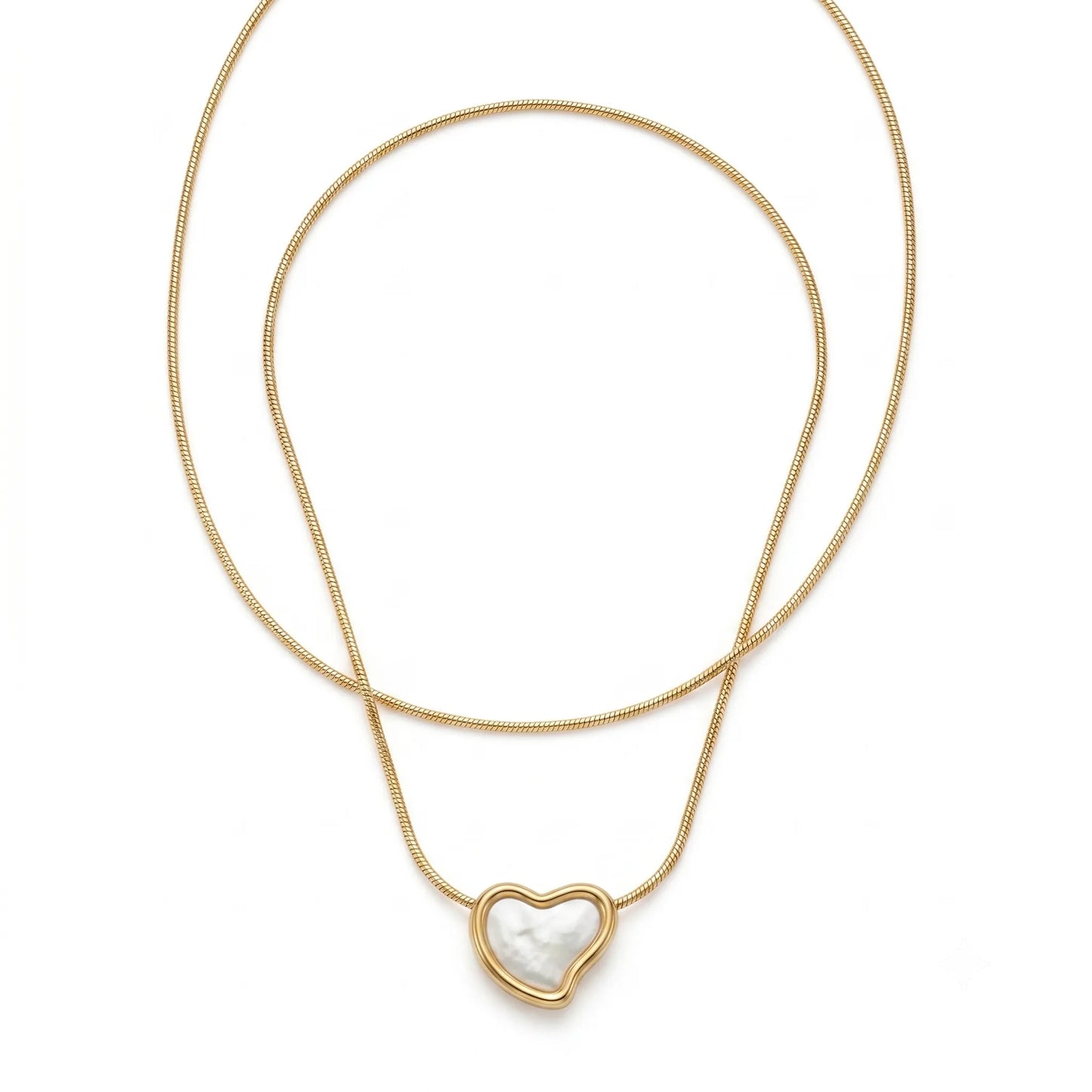 Gold necklace with a heart-shaped pendant on a white background