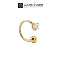 A gold-colored curved barbell nose ring with a bezel-set clear gemstone and a polished ball end, shown on a plain white background with the GoldenNaqsh brand logo at the top.