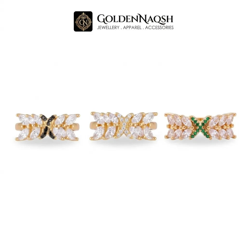 Three gold rings with marquise-cut clear stones and accent colors (black, white, green) displayed on a white background with the GoldenNaqsh brand logo at the top.
