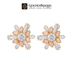 A pair of gold and peach flower-shaped stud earrings with clear marquise and round-cut rhinestones, displayed on a white background with the GoldenNaqsh brand logo at the top.