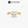 A gold ring with a rectangular clear gemstone in a four-prong setting, shown against a light gray background with the GoldenNaqsh brand logo at the top.