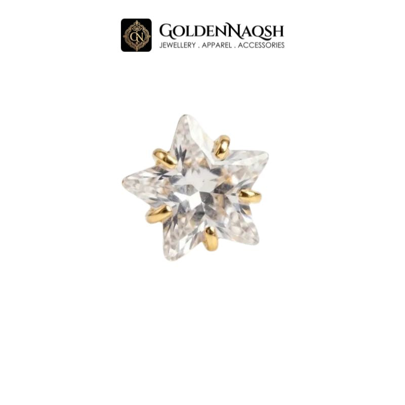 A single star-shaped stud earring featuring a clear faceted crystal set in a gold-tone prong setting, shown against a plain white background with the GoldenNaqsh brand logo at the top.