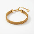 Gold chain bracelet on a white background