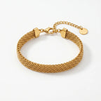 Gold chain bracelet on a white background