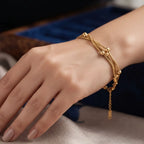 Golden Naqsh 3 Layer Beaded Chain Bracelet featuring three delicate gold snake chains adorned with smooth gold ball stations in a blue jewelry case