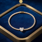 Golden Naqsh Heart Diamond Tennis Bracelet featuring round cubic zirconia stones and a prominent heart-shaped crystal centerpiece