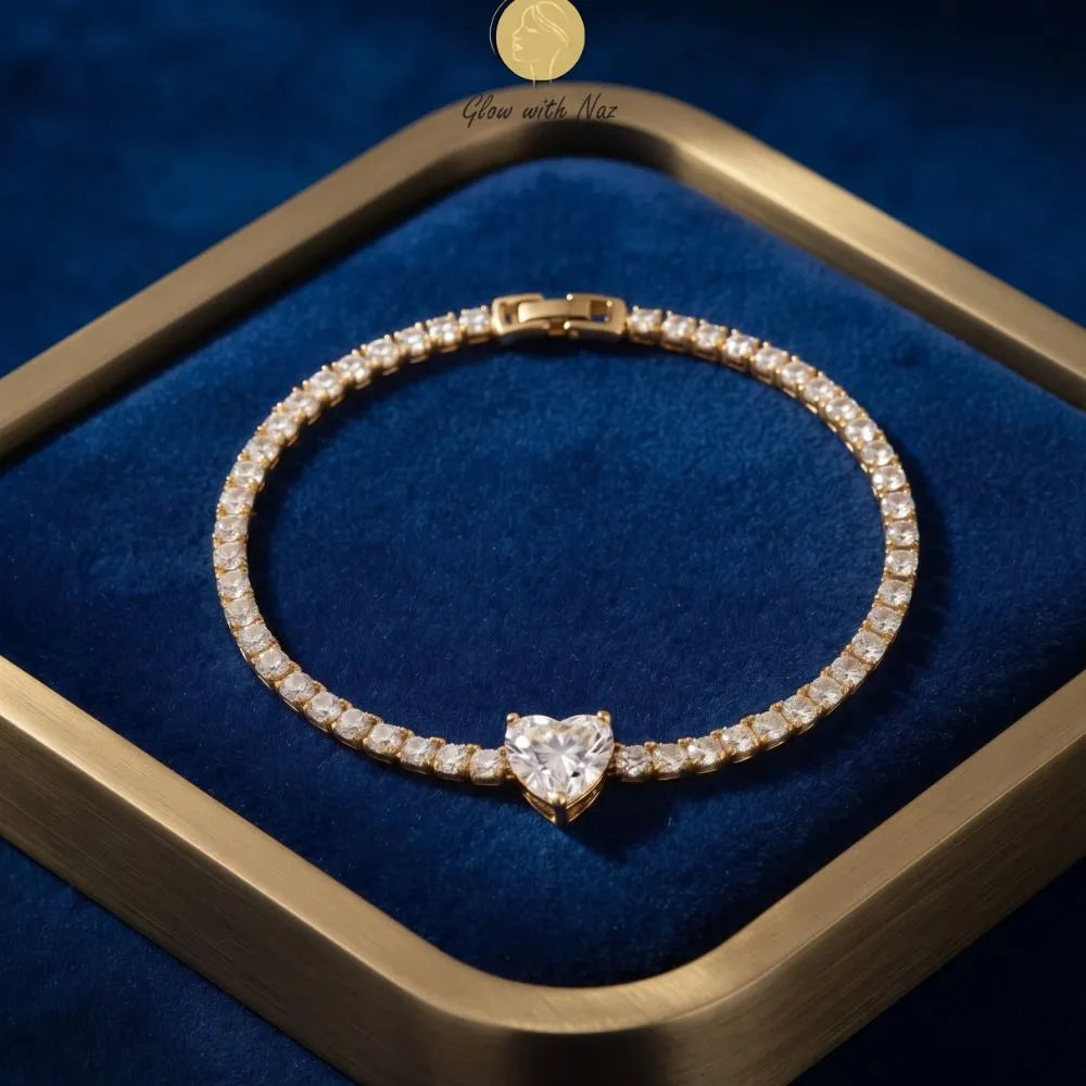 Golden Naqsh Heart Diamond Tennis Bracelet featuring round cubic zirconia stones and a prominent heart-shaped crystal centerpiece
