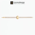 A gold bracelet with a central oval bezel and a fluted band set with small clear stones, displayed horizontally on a white background with the GoldenNaqsh brand logo at the top.